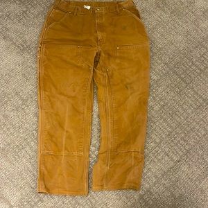 Carhartt double knees, distressed. Hemmed to 32 length.